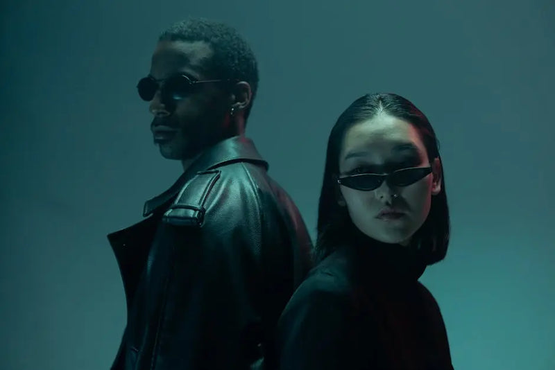 Sunglasses styled with black attire in a restrained editorial portrait for THE NOTICE by THE GRAY CRAB