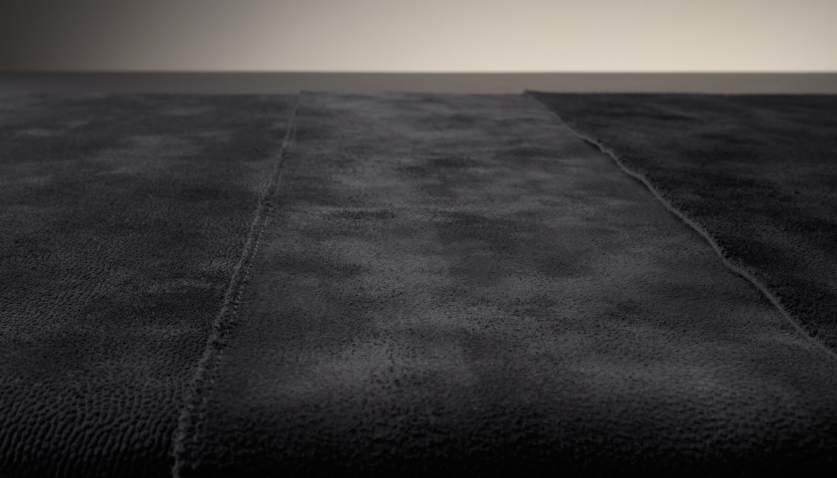 Three-part dark suede material study showing pristine, brushed and water-altered nap textures for THE NOTICE by THE GRAY CRAB.