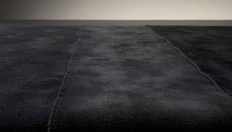 Dark suede material study used by THE NOTICE to examine the surface changes a suede bag owner must be willing to accept.